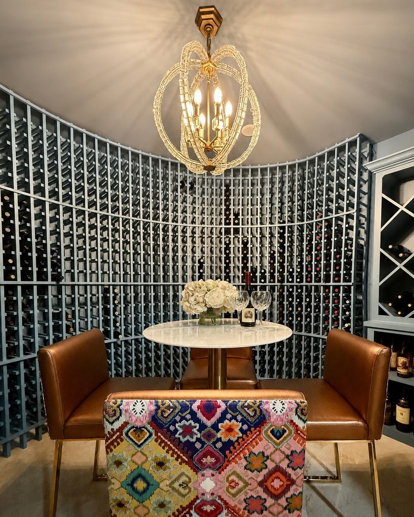 Round wine cellar with a crystal chandelier and a tasting table